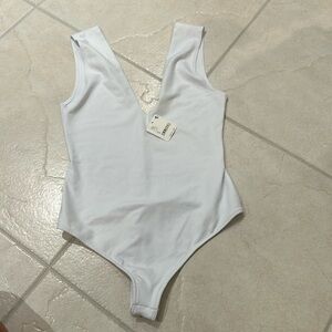 Brand new with tags free people body suit